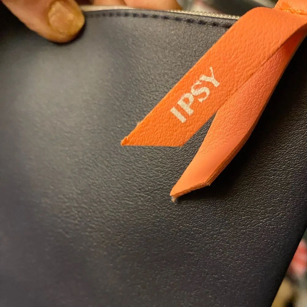 IPSY pouch with orange logo ribbon